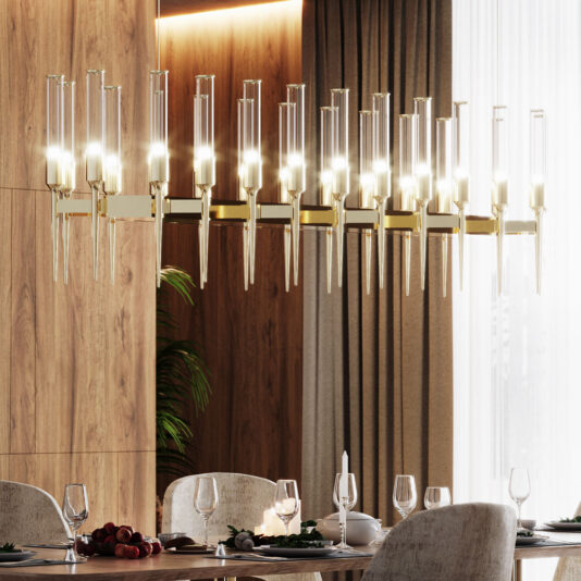 A contemporary dining room showcases the elegant Contemporary Snooker Glass Flute Chandelier, featuring multiple cylindrical lights delicately hanging from a chic gold frame. The table beneath is meticulously set with fine plates, glasses, and candles. Wooden panel walls and expansive windows adorned with curtains enhance the space's warm and sophisticated ambiance.