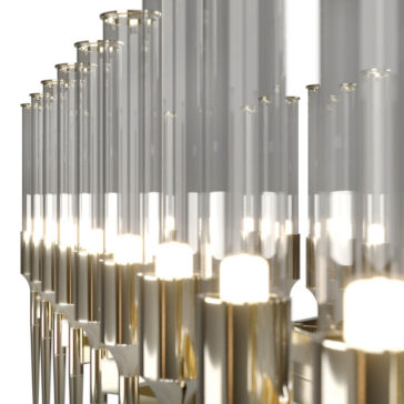 A close-up view of the Contemporary Snooker Glass Flute Chandelier showcases its modern cylindrical glass light fixtures with gold-colored bases. Arranged in rows, these fixtures create a sleek design and emit a soft, warm light.