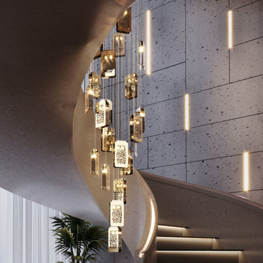 A contemporary spiral staircase with sleek marble steps and a curved, smooth balustrade. The Contemporary Stairwell Chandelier, featuring multiple rectangular pendant lights that emit a warm glow, hangs in the center, enhancing the sophisticated ambiance of this stylish stairwell. Vertical wall lights add to its elegance.