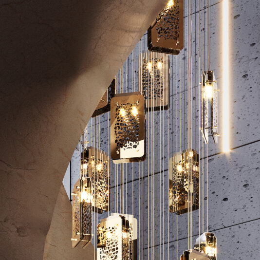 The Contemporary Stairwell Chandelier features rectangular, metallic designs with intricate cut-out patterns and is suspended from the ceiling by thin wires. Against a backdrop of textured concrete and an arched stone wall, these modern hanging light fixtures emit a warm, ambient glow.