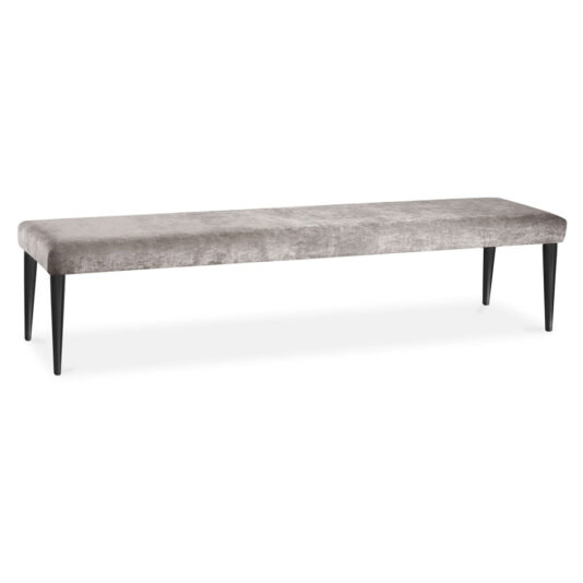 Contemporary Upholstered Bench The Contemporary Upholstered Bench features a luxurious rectangular seat in light grey velvet, supported by four sleek black tapered legs. Its modern and minimalist design makes it perfect for various interior settings.
