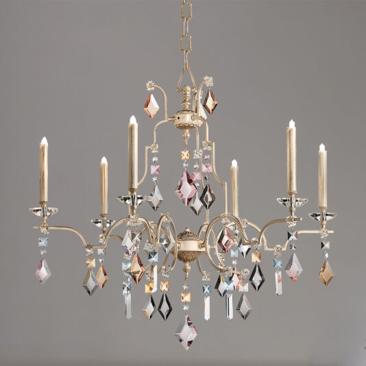The High End Crystal Pendant Chandelier is an elegant lighting fixture featuring six candle-style lights with intricate gold detailing. Adorned with numerous hanging crystals in various shapes and sizes that catch and reflect light beautifully, this chandelier is suspended by a gold chain, set against a neutral gray background.