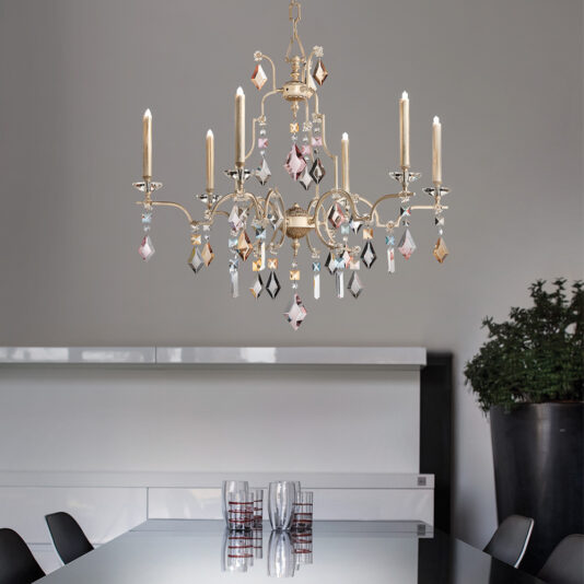 High End Crystal Pendant Chandelier A stunning High End Crystal Pendant Chandelier with eight candle-like lights and sparkling crystal ornaments hangs elegantly over a modern dining table adorned with glassware. The room boasts a minimalist aesthetic, featuring a neutral color palette and a large black plant pot in the background.