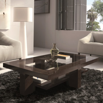 Contemporary Rectangular Coffee Table With Glass Top A modern living room featuring a Contemporary Rectangular Coffee Table With Glass Top and a wooden base, placed on a dark shaggy rug. The table holds a decorative vase and books. Two white armchairs flank the table, while a tall floor lamp stands in the background near a window with blinds.
