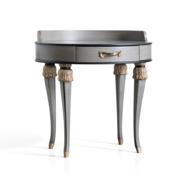 High End Oval Bedside Cabinet With Drawer The High End Oval Bedside Cabinet With Drawer is a sleek, modern piece featuring a small gold-handled drawer in the center. It stands on four curved legs adorned with gold accents at both the top and bottom, and boasts an overall metallic gray finish.
