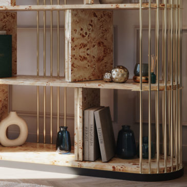 Large Modern Art Deco Style Bookcase A stylish Large Modern Art Deco Style Bookcase displaying a mix of decorative items and books. The shelves are made of marble-like material with vertical golden bars on the sides. Decor includes glass vases, a sculptural object, a small golden orb, and books standing on the lower shelf.