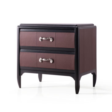 Luxury Leather Horse Handle Bedside Cabinet The Luxury Leather Horse Handle Bedside Cabinet is a dark brown wooden bedside table with two drawers, each adorned with luxurious metallic horse handle pulls. The cabinet features a sleek design with slightly tapered legs and a contrasting black frame that accentuates the edges and corners. Its flat, polished surface adds an elegant touch.