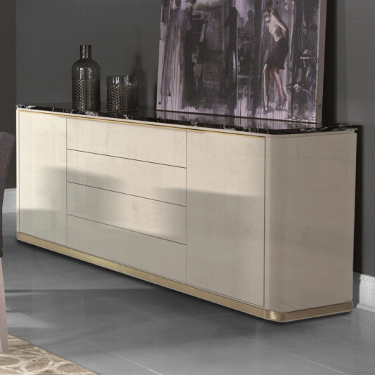 The Luxury Modern Sideboard With Marble Top, featuring a light beige finish and gold accents, is positioned against a dark wall. Its marble surface is embellished with decorative items, including two black vases. Above it hangs an abstract painting in predominantly black and gray tones with subtle hints of a human figure.