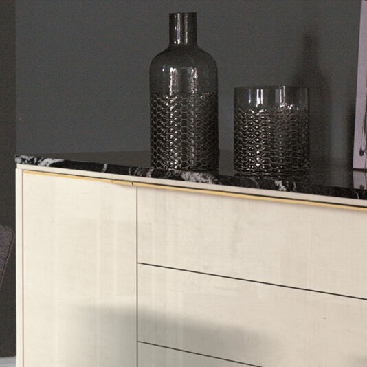 Luxury Modern Sideboard With Marble Top A close-up of the Luxury Modern Sideboard With Marble Top, featuring a light-colored wood finish and a black marble top, stands elegantly against a dark grey wall. On the countertop, two dark translucent decorative vases, one tall and one short, add an extra touch of sophistication.