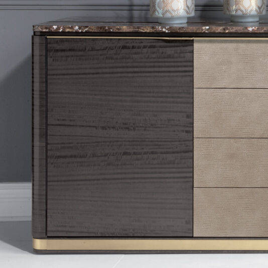 Introducing the Modern Leather Front Sideboard With Marble Top: this stylish piece features a brown wood finish, a luxurious marble top, and elegant gold accents. The left section showcases a dark wood grain pattern, while the right section boasts textured, lighter wood drawers. Two decorative vases elegantly adorn the sideboard against a sophisticated grey wall backdrop.