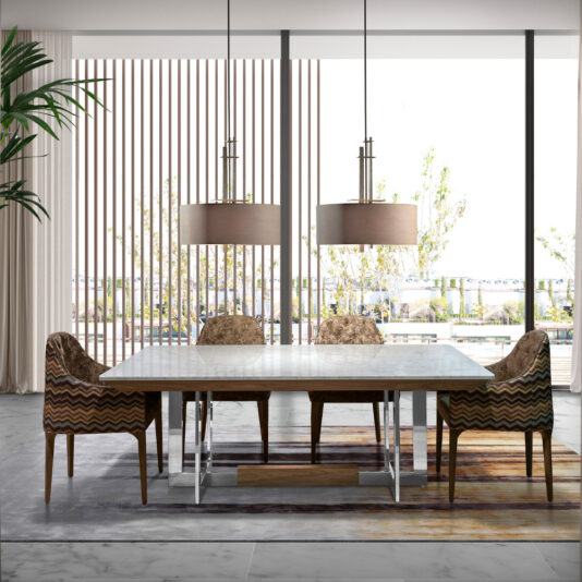 Modern Marble Top Dining Table Modern dining room with a large **Modern Marble Top Dining Table** and six brown chairs. Two large pendant lights hang above the table. Floor-to-ceiling windows with vertical blinds offer a view of an outdoor area with greenery. The floor is marble, and a patterned rug is beneath the table.