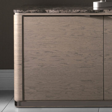 Modern Marble Top TV Unit A close-up of the Modern Marble Top TV Unit showcases its smooth, light brown wooden cabinet. The unit features a sleek, polished marble top that complements its clean lines and minimalist design, standing out against a dark-colored wall.