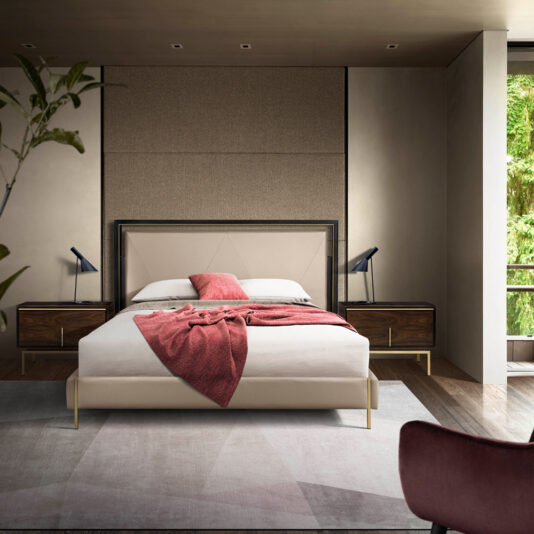 Modern Stylish Bedside Table Modern bedroom with a beige upholstered bed, a red blanket draped across it, and two Modern Stylish Bedside Tables with sleek lamps. The room features a large window showcasing greenery outside, neutral-toned walls, and minimalist decor.