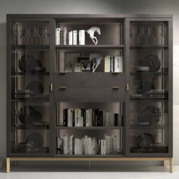 Modern Stylish Wooden Bookcase The Modern Stylish Wooden Bookcase features contemporary wooden craftsmanship with glass doors, providing ample space for various items. The shelves elegantly display books, decorative sculptures, and sets of wine glasses. Its sleek design embraces a minimalist aesthetic, complete with a centrally positioned drawer and two cabinets.