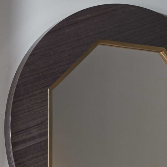A close-up of the Modern Wooden Octagonal Mirror reveals its sleek design, featuring a dark wood frame with a smooth, polished surface and minimal decoration. The clean mirror reflects a softly lit, neutral-colored background.