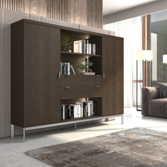 A modern living room features a sleek, dark wooden cabinet with open shelves displaying books and potted plants. The Modern Wooden Bookcase has closed compartments illuminated by LED lights, and the room is adorned with a large window, brown couch, floor lamp, and a textured rug on a light floor.
