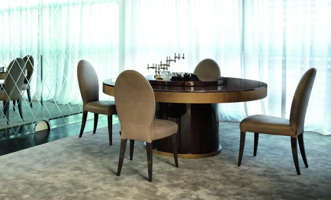 dining room with round walnut veneer Italian designer dining table and chairs