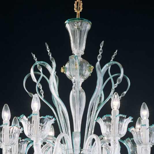 A close-up of the Elegant Chandelier With Teal Detailing reveals its ornate and sophisticated design, highlighted by clear glass arms with intricate detailing. The chandelier showcases several twisted, clear glass decorations enhanced with subtle teal accents and features eight candle-shaped light bulbs nestled in delicate, flower-shaped glass holders. The black background further accentuates its elegance.