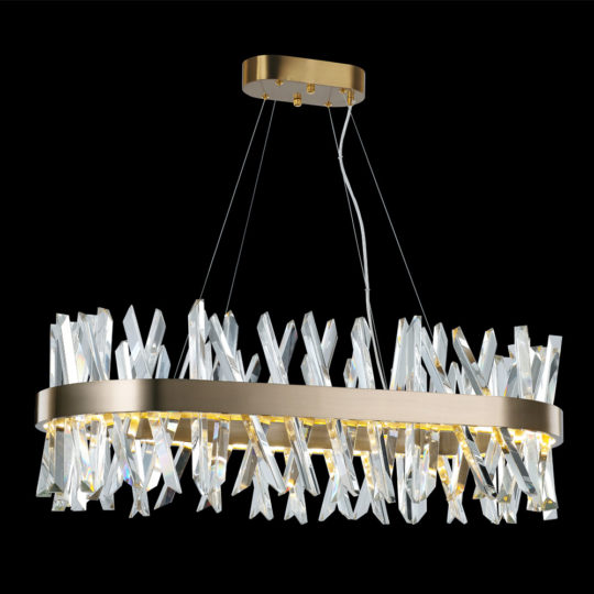 The Oval Crystal And Brass Chandelier is a modern piece featuring a rectangular gold frame adorned with multiple crystal-like X-shaped elements. This chandelier, suspended by thin wires and set against a black background, exudes elegance and luxury as the crystals reflect light beautifully.