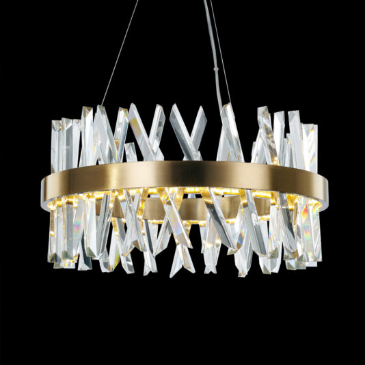 Round Crystal And Brass Chandelier Introducing the Round Crystal And Brass Chandelier: a contemporary piece with a circular gold frame, beautifully adorned with sleek, clear crystal prisms hanging at various angles. It’s illuminated against a black background and supported by two thin wires from above.