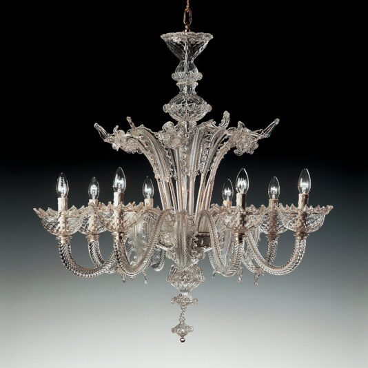 A luxurious and intricately designed crystal chandelier, the "Classic Floral Clear Glass Chandelier" features eight candelabra-style light bulbs arranged in a circular pattern. This elegant piece showcases elaborate floral detailing in clear glass and is suspended from a chain, set against a gradient dark background.