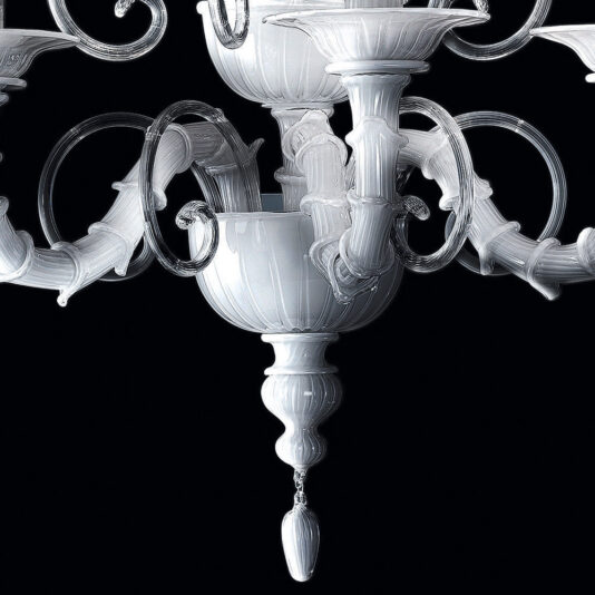 A close-up of the Classic White Glass Wall Light against a black background. This wall light showcases intricate glasswork with curved arms, decorative bowls, and a teardrop-shaped pendant at the bottom. The design is elegant and highly detailed, reminiscent of an ornate white chandelier.
