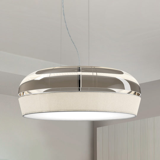 The Contemporary Dome Glass Pendant Light hangs elegantly from the ceiling by a slender wire. It boasts a glossy metallic top and a textured, translucent glass bottom, providing a soft and even illumination throughout the room. The surrounding minimalistic home decor enhances its modern aesthetic.