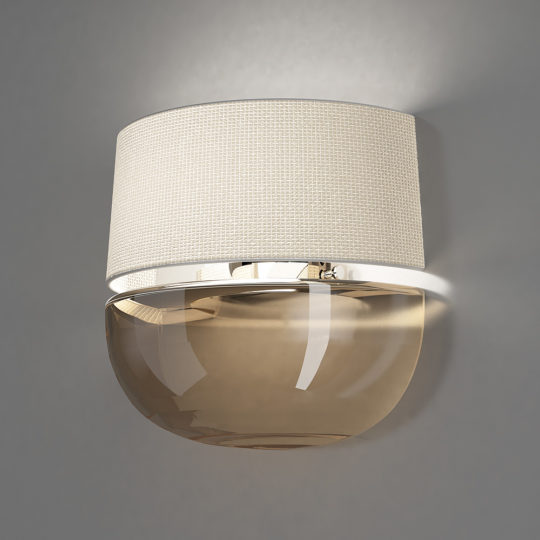 The Contemporary Dome Glass Wall Light boasts a beige, fabric-textured cylindrical lampshade paired with a glossy, translucent amber glass dome beneath it, all mounted on a sleek silver base. This modern wall sconce emits a subtle glow that accentuates its minimalistic design.