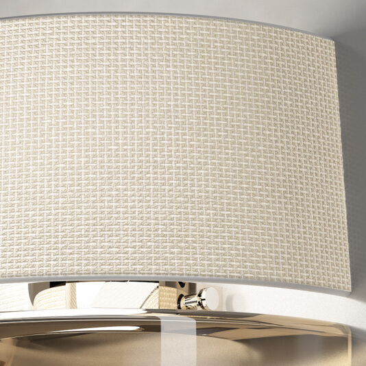 Close-up of the Contemporary Dome Glass Wall Light featuring a beige, textured lampshade adorned with a detailed woven pattern. The lampshade partially covers the shiny, metallic lamp fixture, which reflects light beautifully. The soft and neutral background accentuates the elegant design of this contemporary piece.