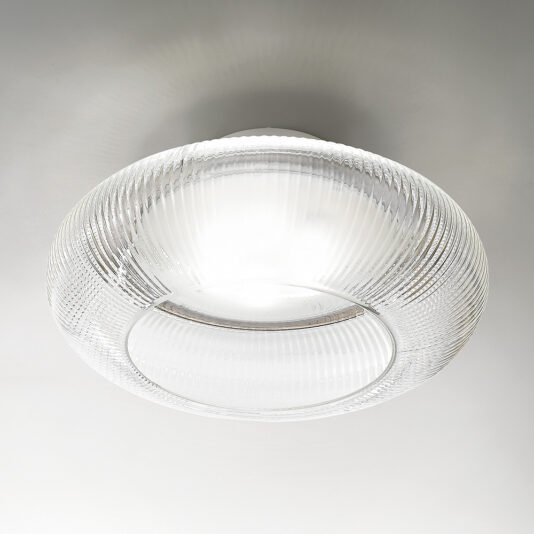 The Contemporary Ribbed Glass Ceiling Light boasts a modern, circular design with ribbed glass and a smooth, clear center that allows light to shine through, casting a soft, diffused glow. This stylish fixture is mounted on a plain white ceiling.
