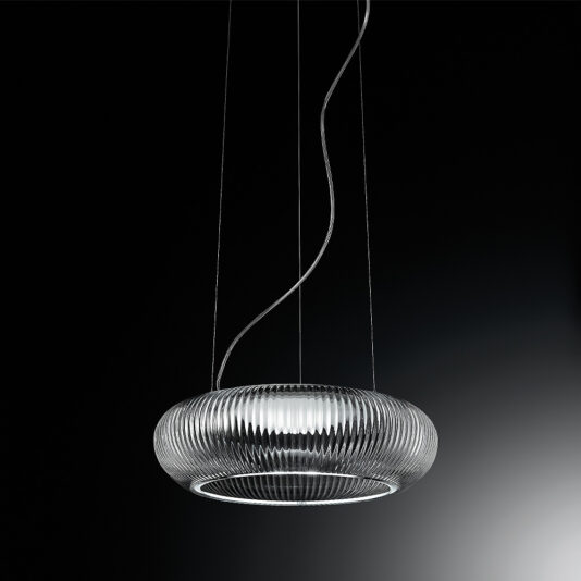 The Contemporary Ribbed Glass Pendant Light With Silver Frame is a modern, circular chandelier that features a textured, transparent glass shade and hangs from the ceiling on three slightly curved, thin cables. This elegant light fixture casts a soft, white light against a dark background and boasts an elegantly sleek design.