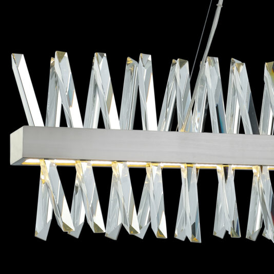 Narrow Nickel Crystal Chandelier The Narrow Nickel Crystal Chandelier showcases a sleek, modern design with a horizontal, rectangular metallic frame in narrow nickel. It is adorned with a series of twisted, clear acrylic or glass elements arranged diagonally to form an elegant geometric pattern against a solid black background.
