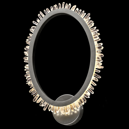 Introducing the Exclusive Quartz Crystal Nickel Wall Light, a circular backlit sculpture beautifully framed in black. This distinctive piece features evenly spaced, illuminated quartz crystal-like protrusions along its edges, all elegantly mounted on a circular base against a perfectly black background.