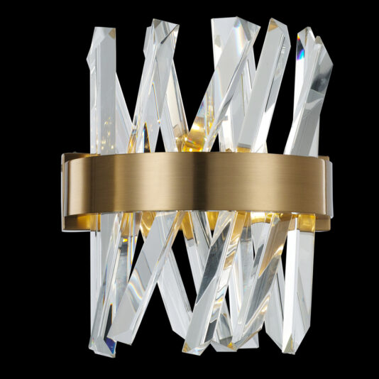 Introducing the Exclusive Crystal Brass Wall Light, showcasing a sophisticated brass band that encircles a grouping of angular, transparent crystal shards. These crystals are meticulously arranged in a dynamic, overlapping pattern, resulting in a visually captivating and modern design. The fixture is elegantly highlighted against its black background.