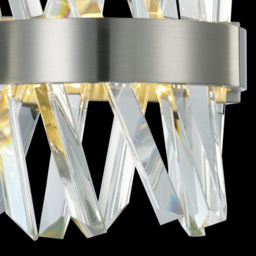 Exclusive Crystal Nickel Wall Light Close-up of the Exclusive Crystal Nickel Wall Light highlighting a sleek brushed metal band adorned with multiple vertically arranged crystal prisms that reflect light. The design creates a dramatic interplay of light and shadow, enhancing the sophisticated aesthetic of the fixture.