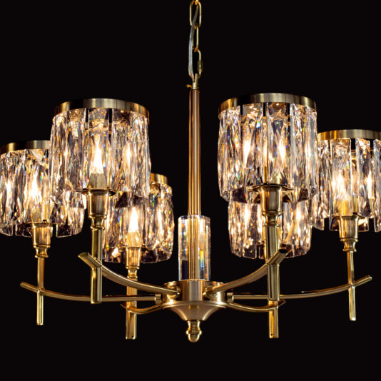 High End 6 Arm Nickel Chandelier
A luxurious, vintage-style High End 6 Arm Nickel Chandelier with multiple crystal lampshades, suspended against a black background. The chandelier's crystal lampshades emit a warm glow, showcasing intricate detailing and beautifully reflecting light.
