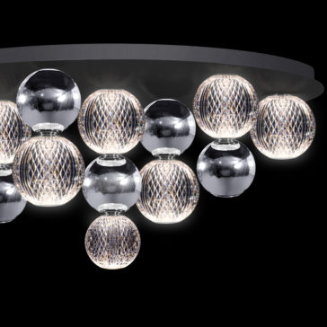 Luxury Chrome Globe Ceiling Light The Luxury Chrome Globe Ceiling Light is a high-end ceiling fixture that features multiple spherical bulbs encased in reflective metal and mesh covers, creating a stylish and illuminated design. The globe fixture has a sleek, circular base from which the bulbs are suspended at varying lengths.
