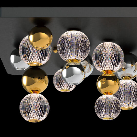 The Luxury Gold And Silver Ceiling Light Cluster features a collection of spherical lights decorated with intricate patterns. Some spheres boast a golden hue, while others are metallic and transparent, creating a modern and luxurious appearance against the dark background.
