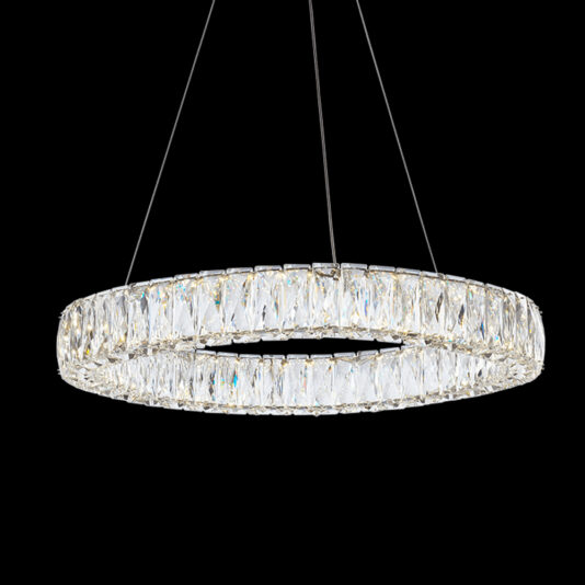 The Luxury Round Crystal Chandelier, showcasing a modern design, hangs elegantly against a black background. It features rectangular crystal pieces meticulously arranged to form a glowing, sophisticated ring, suspended by thin wires.