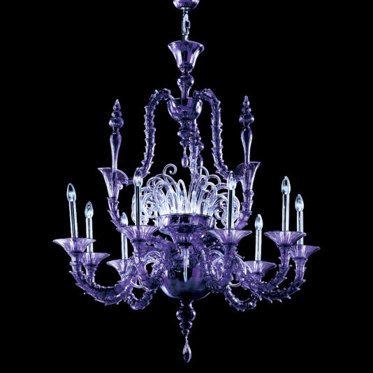 The Classic Ornate Purple Glass Chandelier, featuring intricate detailing, is suspended against a black background. It boasts multiple arms adorned with candle-like lights, showcasing its elegant and ornate design.