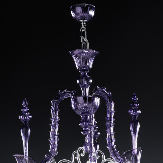 Classic Ornate Purple Glass Chandelier Close-up of the Classic Ornate Purple Glass Chandelier against a black background. This luxurious chandelier features intricately designed, curved glass arms and elaborate decorative elements, highlighting its elegant and sophisticated craftsmanship.