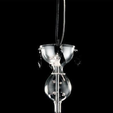 Traditional Chandelier With Black Crystal Drops The Traditional Chandelier With Black Crystal Drops is a hanging glass sculpture featuring a spherical lower chamber with geometric patterns and beads, a smaller upper bowl adorned with clear and black crystal drops, and thin black cords for suspension, all set against a black background.