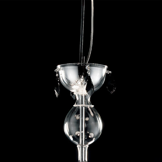 Traditional Chandelier With Black Crystal Drops The Traditional Chandelier With Black Crystal Drops is a hanging glass sculpture featuring a spherical lower chamber with geometric patterns and beads, a smaller upper bowl adorned with clear and black crystal drops, and thin black cords for suspension, all set against a black background.