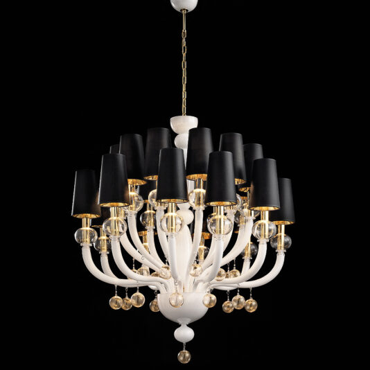 The Traditional Glass Orb Detail Chandelier is a luxurious piece featuring a white and gold frame. Each arm, adorned with golden accents and glass orb details, holds a black lampshade. Suspended from a chain, this chandelier’s sophisticated elegance stands out beautifully against a black background.