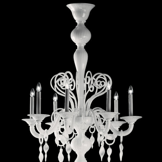 Traditional Three-Tier White Glass Chandelier The Traditional Three-Tier White Glass Chandelier showcases an array of six candle-shaped lights adorned with small lampshades. This elegant piece features intricate, curving designs and decorative elements, all beautifully contrasted against a black background.