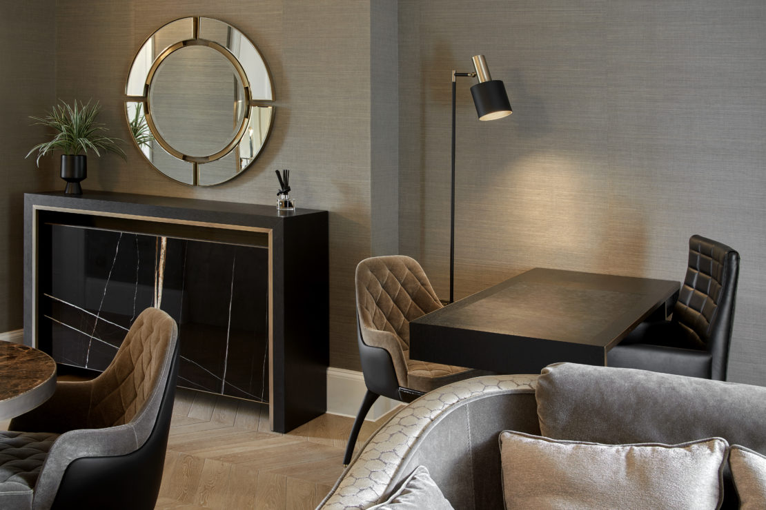 Gentleman's pad sideboard, round luxury mirror and seating arrangements for desk, sofa and dining table