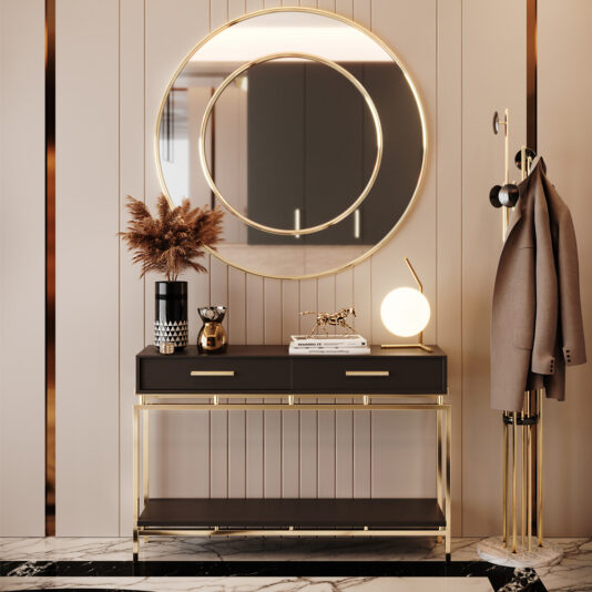 Art Deco Inspired Console Table An elegant entryway features the Art Deco Inspired Console Table positioned beneath a large, round mirror. The table is adorned with a vase filled with dried flowers, a sculpted cheetah, and a spherical lamp. Completing the refined, modern look is a coat stand holding a beige coat.