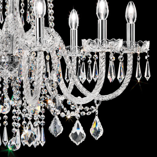 Blown Glass Chandelier With Crystal Drops A close-up view of the Blown Glass Chandelier With Crystal Drops, featuring multiple candle-like light bulbs and adorned with intricate crystal beads and prisms. The light reflects off the crystals, creating a sparkling effect against a black background.