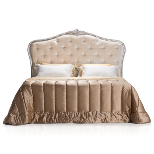 Elegant Classic Style Button Upholstered Bed The Elegant Classic Style Button Upholstered Bed features a tall, elegant headboard adorned with silver accents. It is neatly made with a satin-like beige comforter and two white pillows at the head, creating an overall sophisticated and stylish look that exudes timeless elegance.