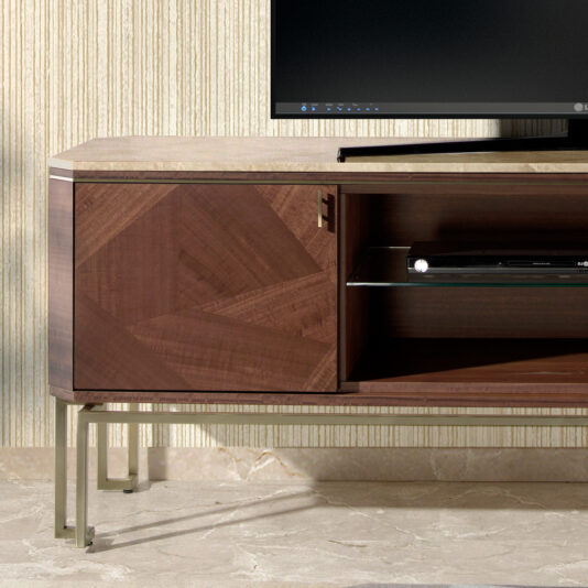 Elegant Modern TV Unit The Elegant Modern TV Unit showcases a sophisticated geometric pattern on its left door, a luxurious marble top, and chic metal legs. The right side features an open shelf accommodating an electronic device, while the corner of a flat-screen TV is visible atop the unit. The marble floor harmonizes beautifully with the striped wall background.